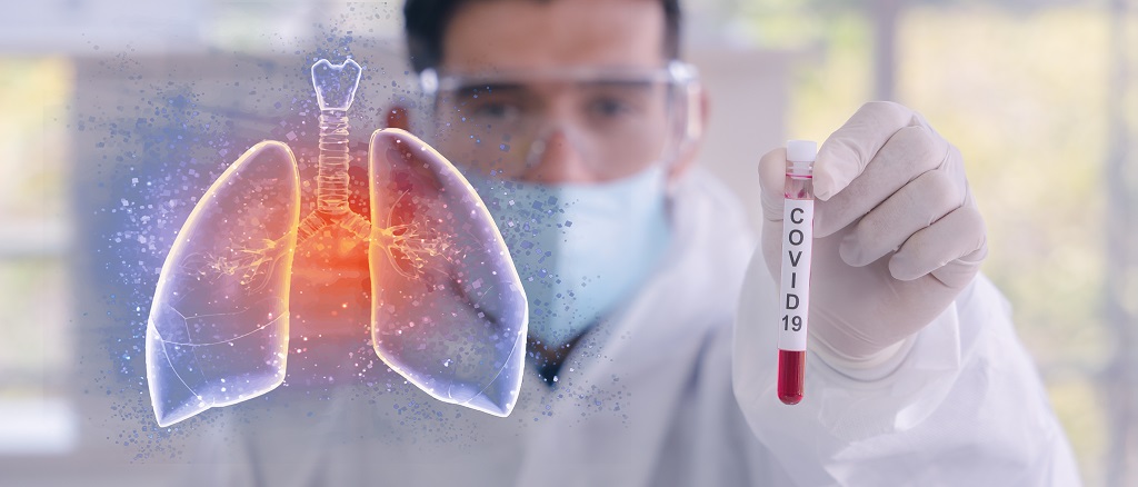 double exposure of coronavirus covid-19 infected blood sample in sample tube in hand of scientist with biohazard protection cloth and pneumonia lung